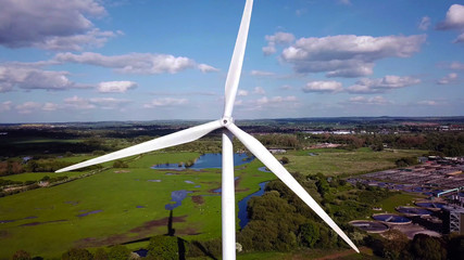 Wind turbine and agricultural fields in summer day, Energy Production, drone aerial view
