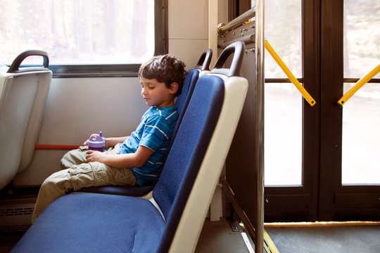 Boy Sitting On Bus 