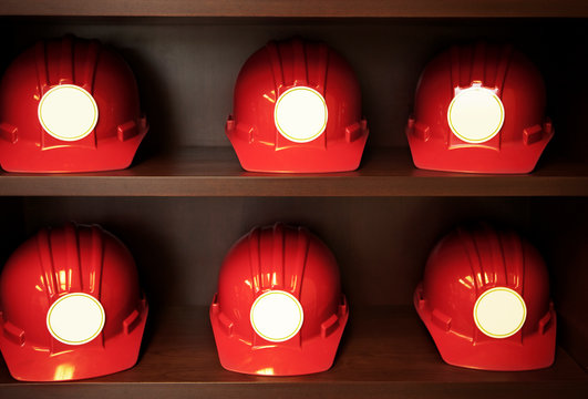 Factory worker's hard hats on shelves 