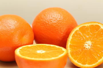 Fresh Oranges on a Wooden board. White background.