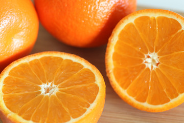Fresh Oranges on a Wooden board. White background.