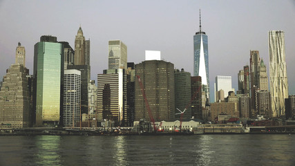 East river and Manhattan skyline with view of urban skyscrapers early Morning