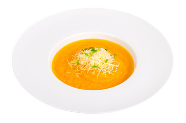 Vegetable soup with grated cheese isolated on white background.