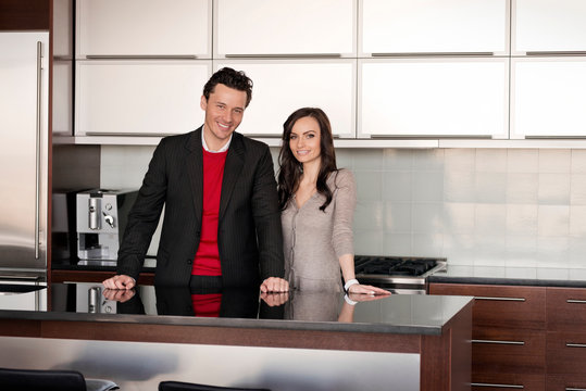 Couple standing at kitchen counter 