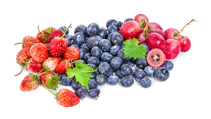 Big Pile of Fresh Berries on the White Background. Ripe Sweet Strawberry, Raspberry, Blueberry, Blackberry