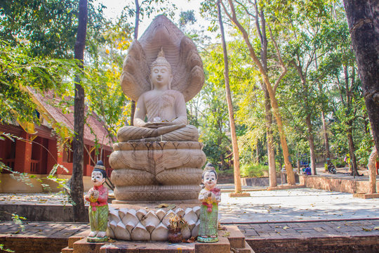 Ancient stone Buddha image statue at Wat Umong Suan Puthatham, a 700-year-old Buddhist temple in Chiang Mai, Thailand. Wat Umong is famous Buddhist temple, tourist can learn meditation from the monks.