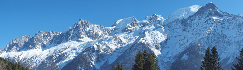 Naklejka premium Amazing landscape at the summits of the Mont Blanc range on the French side. Blue sky. Winter season