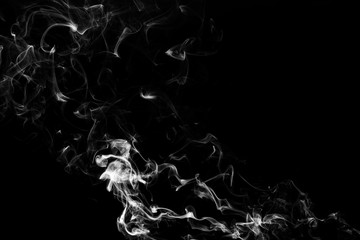 Smoke the white incense on a black background. darkness concept