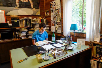 WEST CORNWALL CT. USA A 14 year old teenager reading in an antiquarian bookstore