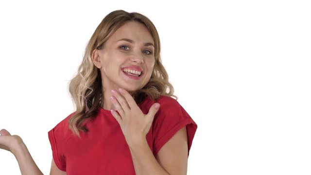Female blonde woman talking to camera being very happy on white background.