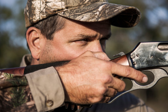 Hunter Aiming His Rifle 