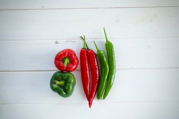 red chili peppers on wooden background