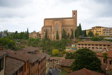 Fototapeta na wymiar View of the Basilica of Cateriniana Di San Domenico on a cloudy September day. Siena, Italy