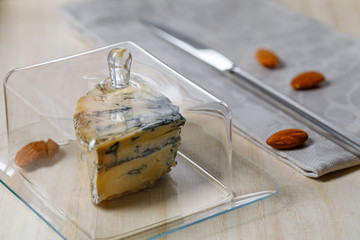 cheese slices prepared for serving, table setting, etiquette, snack, gourmet food. Soft focu