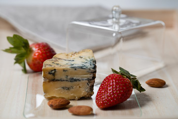 cheese slices prepared for serving, table setting, etiquette, snack, gourmet food. Soft focu