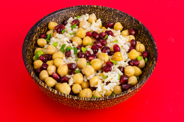 Vegetarian dish with chickpeas, rice, pomegranate.