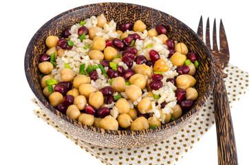 Vegetarian dish with chickpeas, rice, pomegranate.