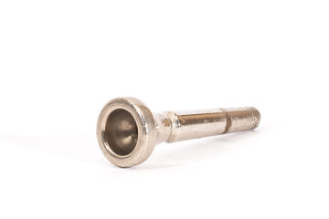 The old mouthpiece from the wind instruments on a white background