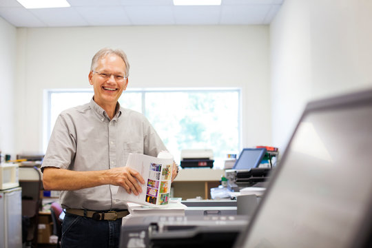 Small business owner smiling while working 
