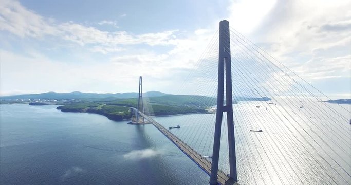 Aerial view of Russian bridge, the longest cable-stayed bridge in the world. It connects the Russky Island and Vladivostok across the Eastern Bosphorus strait. Light morning fog
