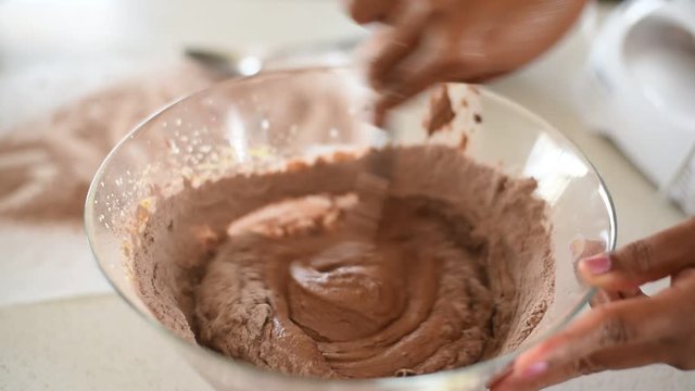 woman making  chocolate cake mix