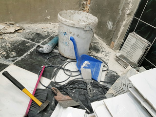 Repair building with tools and hammer, chisel, cleaver, brush, dustpan and tape measure on the...