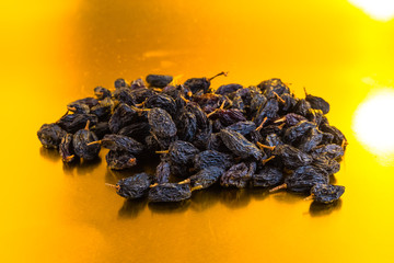 raisins on a gold background