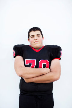 Studio portrait of football player (16-17) 