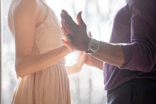 Elegant couple holding hands 
