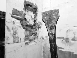 a drill from a perforator, a chisel and a strobe in a brick wall and a propylene pipe - plumbing in...