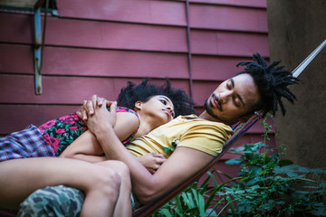 Couple in garden in hammock 