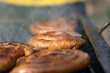 Cooking Delicious Juicy Meat Sausages On The Grill