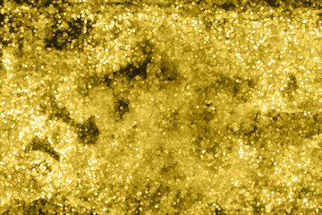 Blurred golden texture from shining circles