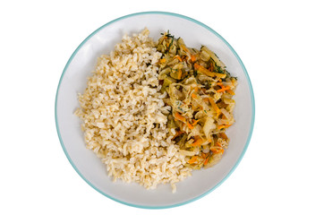 Vegetarian healthy food. Braised cabbage with carrots, brown rice.