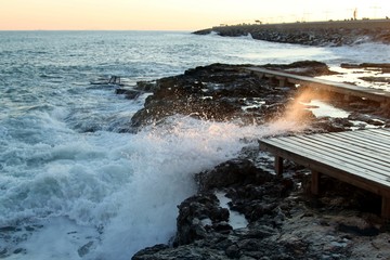 Storm waves on the beach coast summer heat stones sky water Mediterranean Spain