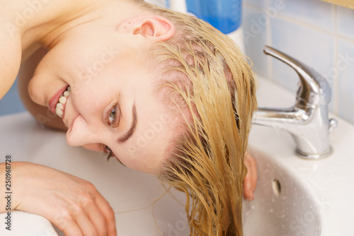 Woman Washing Hair In Bathroom Sink Stock Photo And Royalty