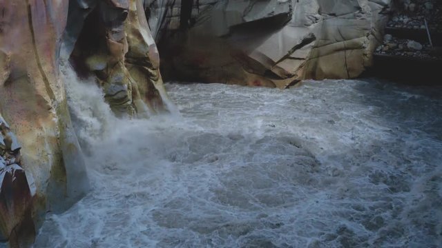 Surya Kund waterfall at Gangotri near Gangotri Temple, Himalayan Range Uttarakhand India.Pay obeisance to Sun God Waterfall Surya Kund on holy river Ganges on background mountain town Gangotri deodar.