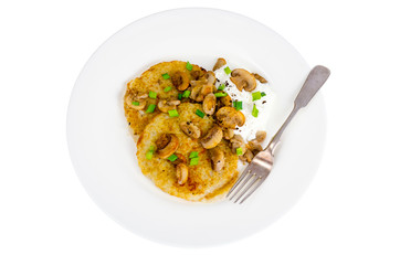 Plate with potato pancakes, fried mushrooms, isolated on white background.