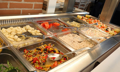 self service restaurant with many raw and cooked foods