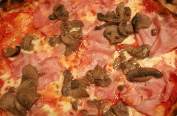 Italian pizza with ham and mushrooms