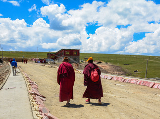 Tibetan monks sitting on the hill