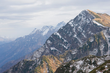 Fototapeta na wymiar Beautiful mountain landscape. Sharp snowy mountain peaks. Caucasus. Krasnaya Polyana, Sochi.