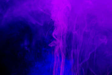 Fototapeta na wymiar Smoke colorful background. Neon colors explosion. Blue pink smoke flowing.