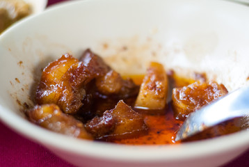 Sweet pork belly in bowl which is the popular food of Thailand southern
