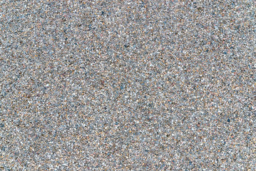 White granite gravel stones flooring pattern surface texture. Close-up of exterior material for design decoration background