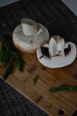 fresh mushrooms with herbs on a cutting board