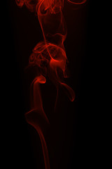 Movement of red smoke on black background