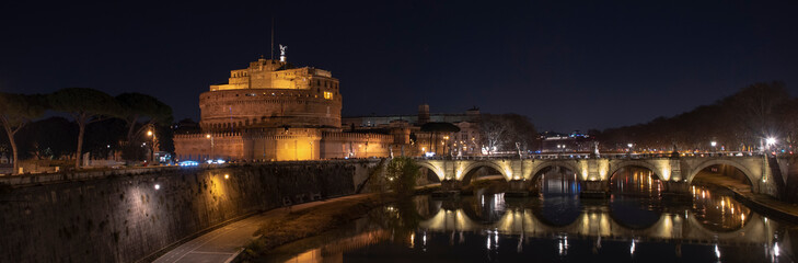 Rome Italy. Beautiful view of Castel Sant'Angelo and the bridge at night with reflections on the...