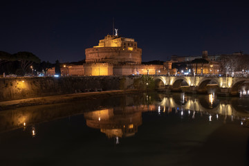 Rome Italy. Beautiful view of Castel Sant'Angelo and the bridge at night with reflections on the...