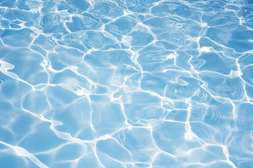 Texture of water in swimming pool for background